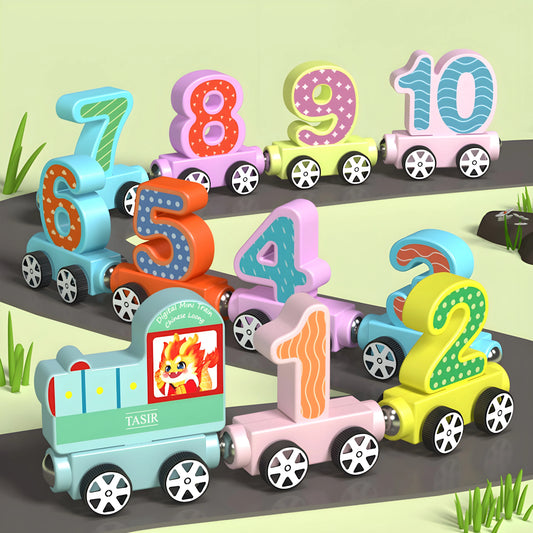 Colorful number magnetic train toys on a track with a grassy background