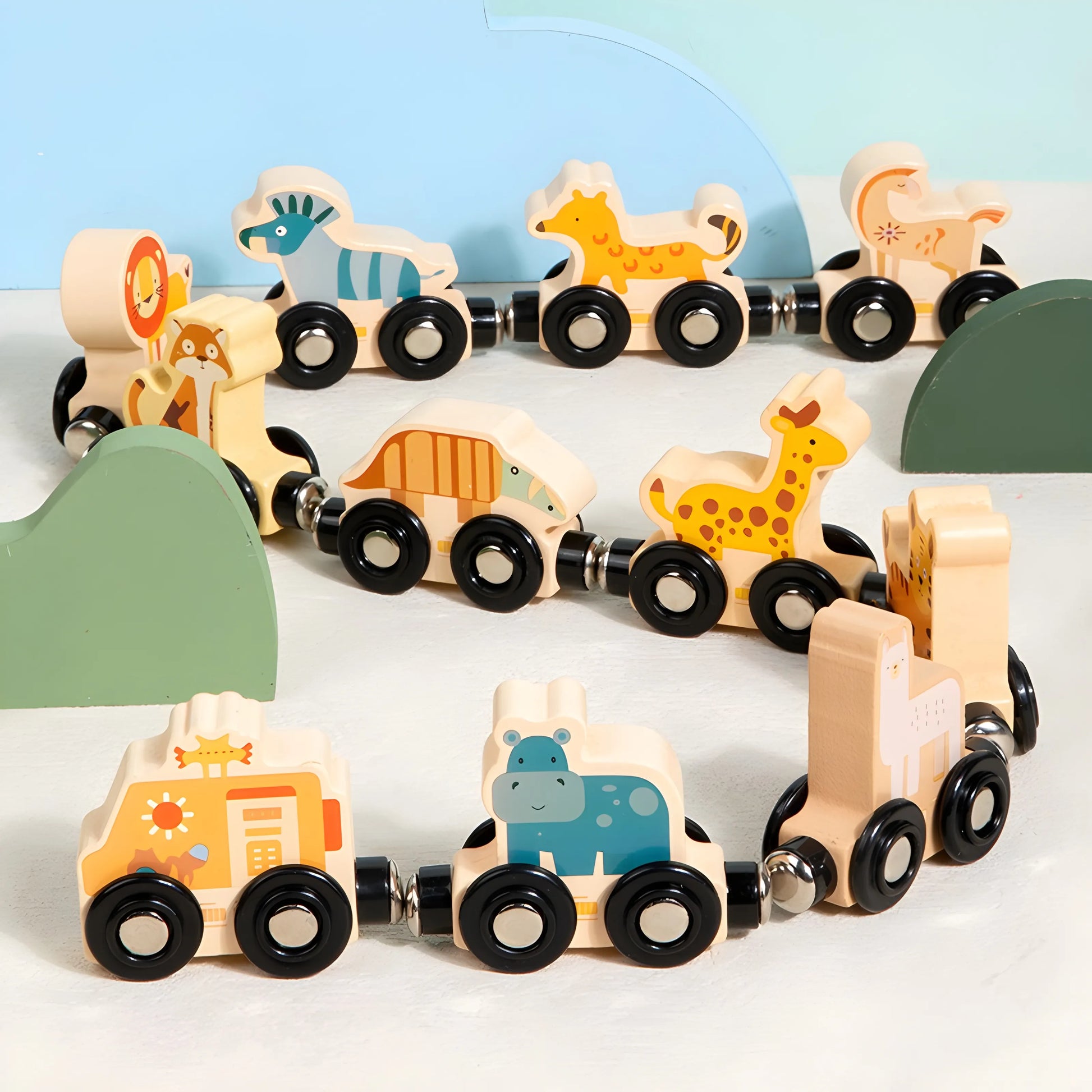 magnetic Wooden toy train set with animal figures on a light background