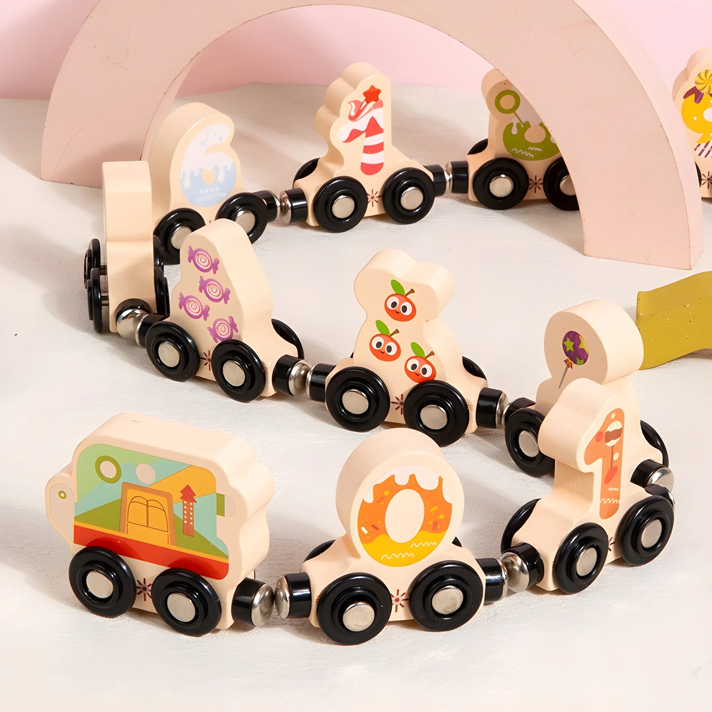 magnetic Wooden toy train with numbered and character-themed cars on a white background