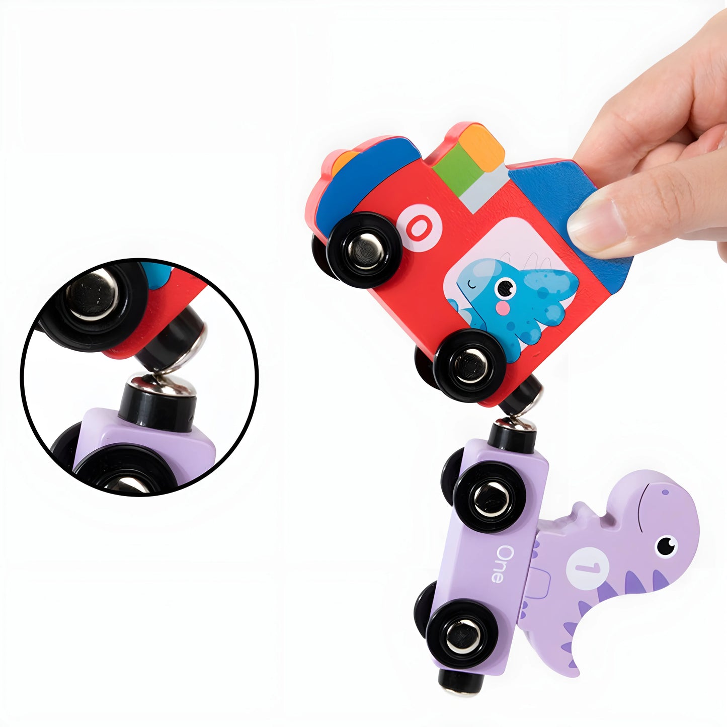Colorful magnetic toy with wheels and a hand holding it, on a white background