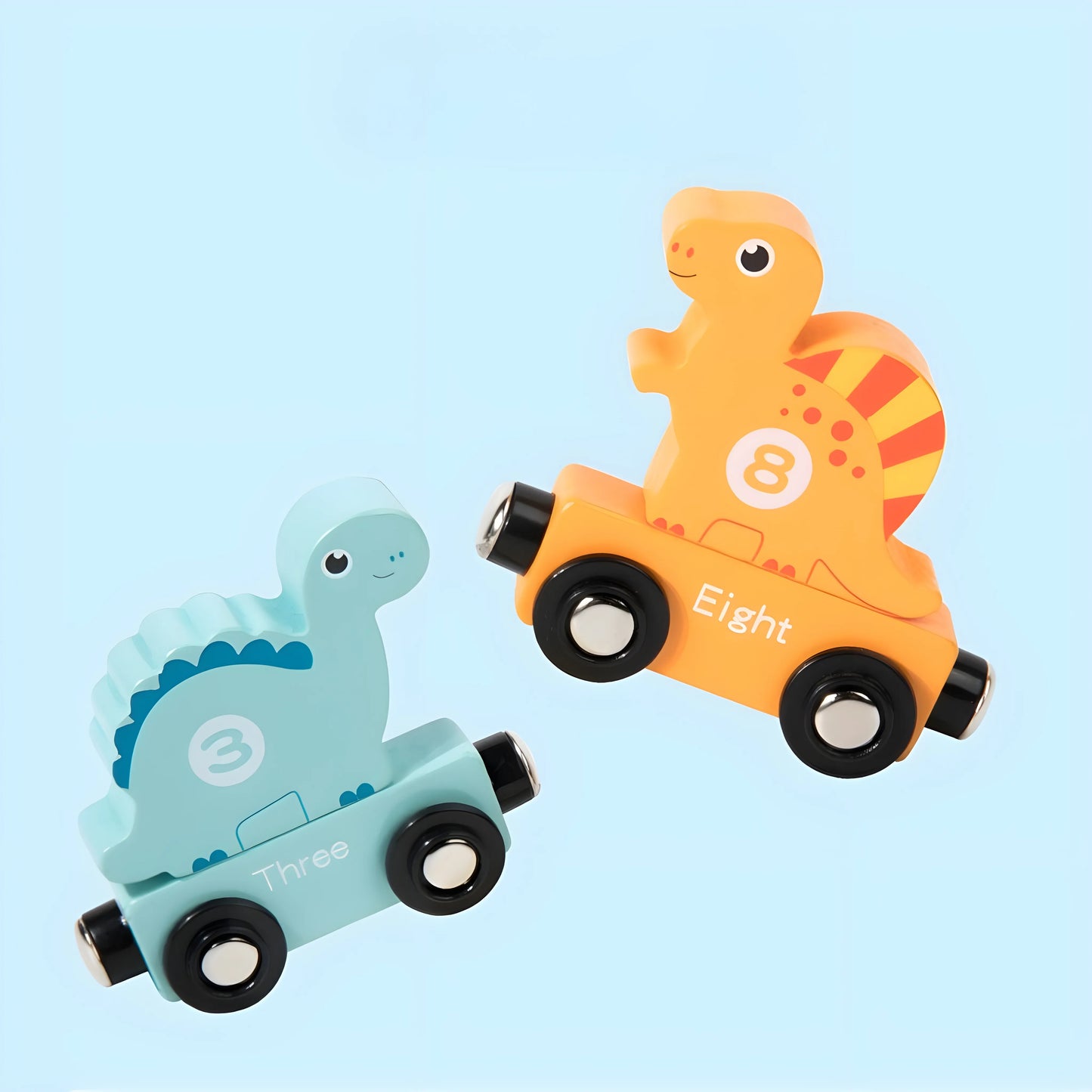 Two magnetic dinosaur-shaped toys, one orange and one blue, on a light blue background.