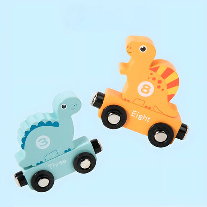 Two magnetic dinosaur-shaped toys, one orange and one blue, on a light blue background.