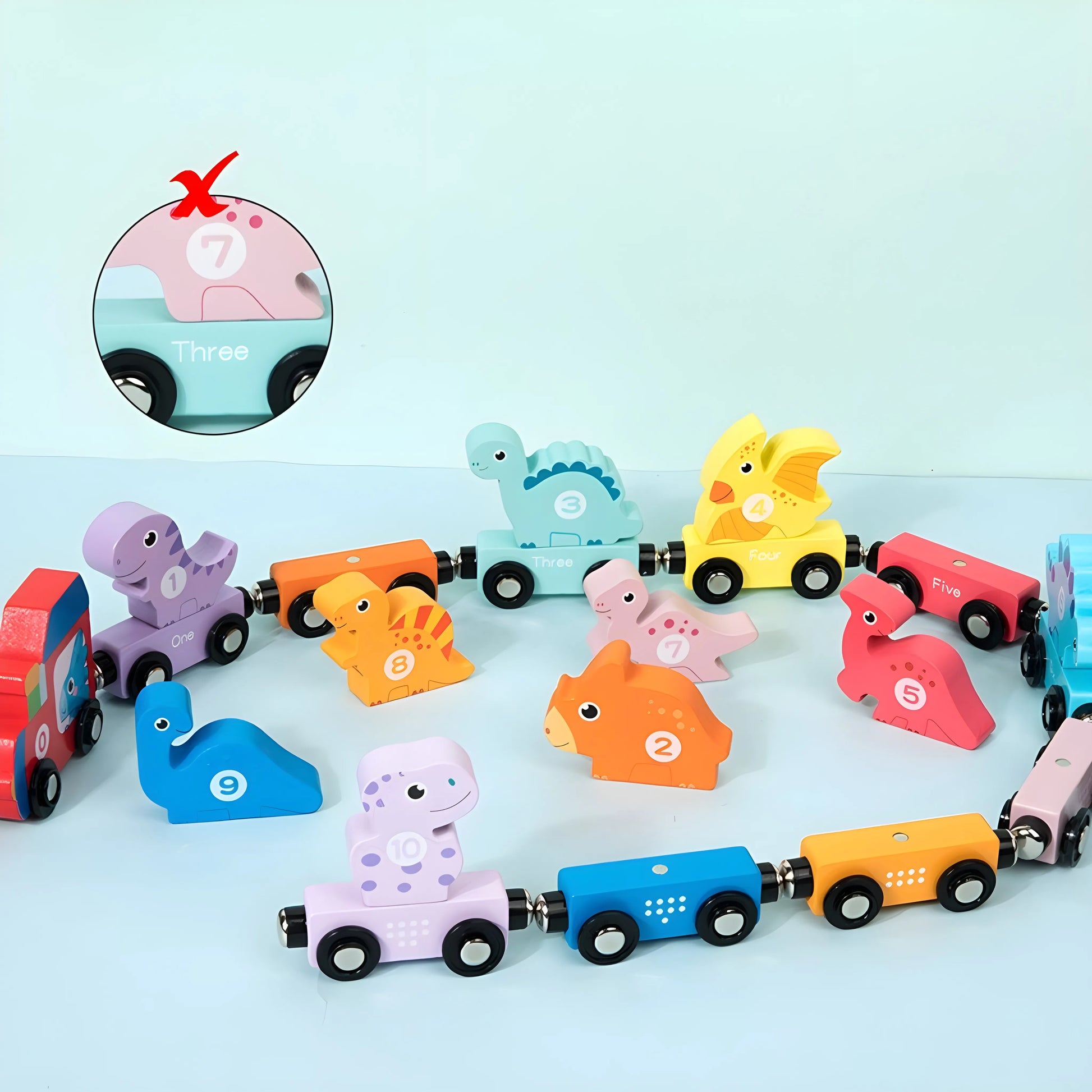 magnetic toy train set with animal-shaped cars on a light blue background
