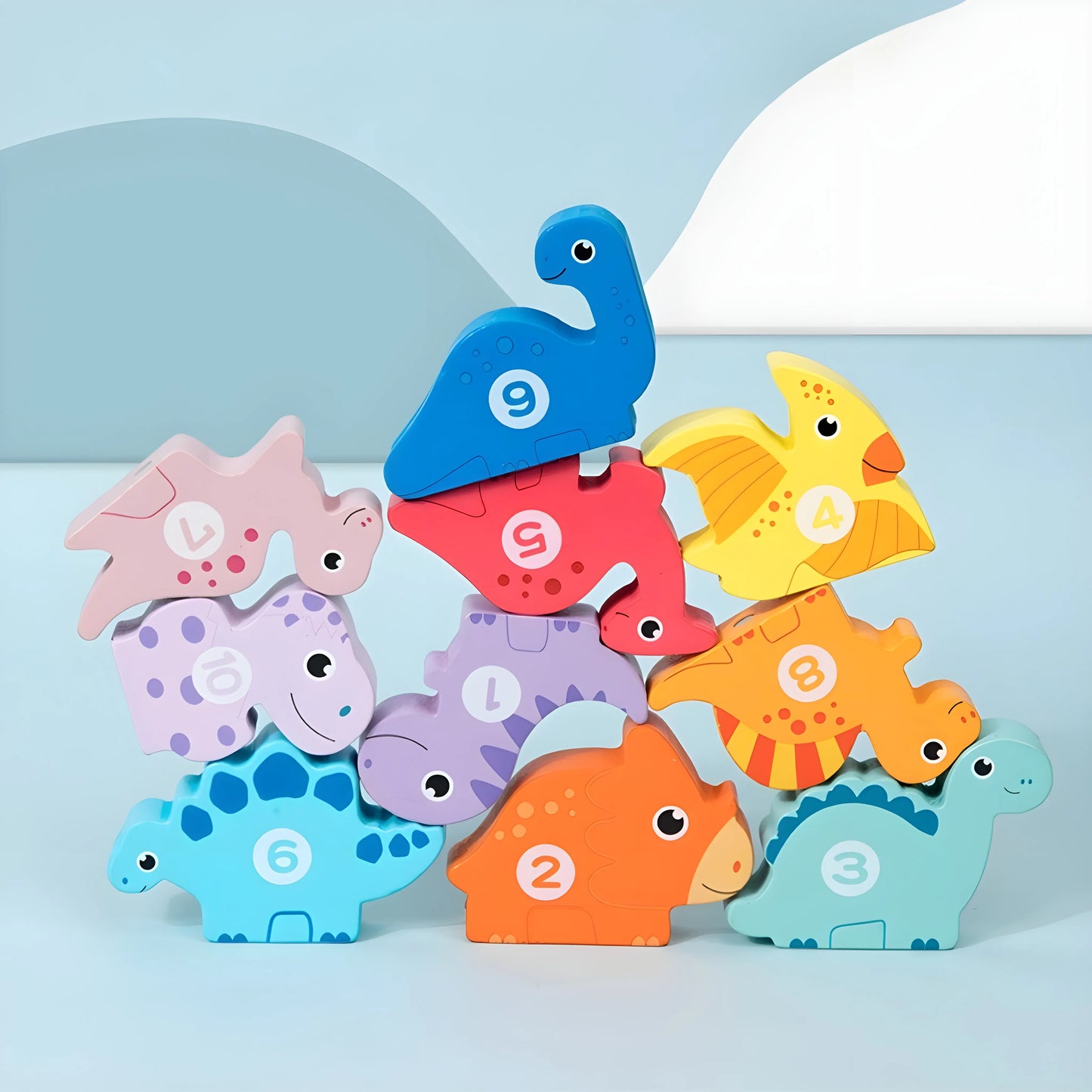 Stack of magnetic dinosaur-shaped number blocks on a light blue background