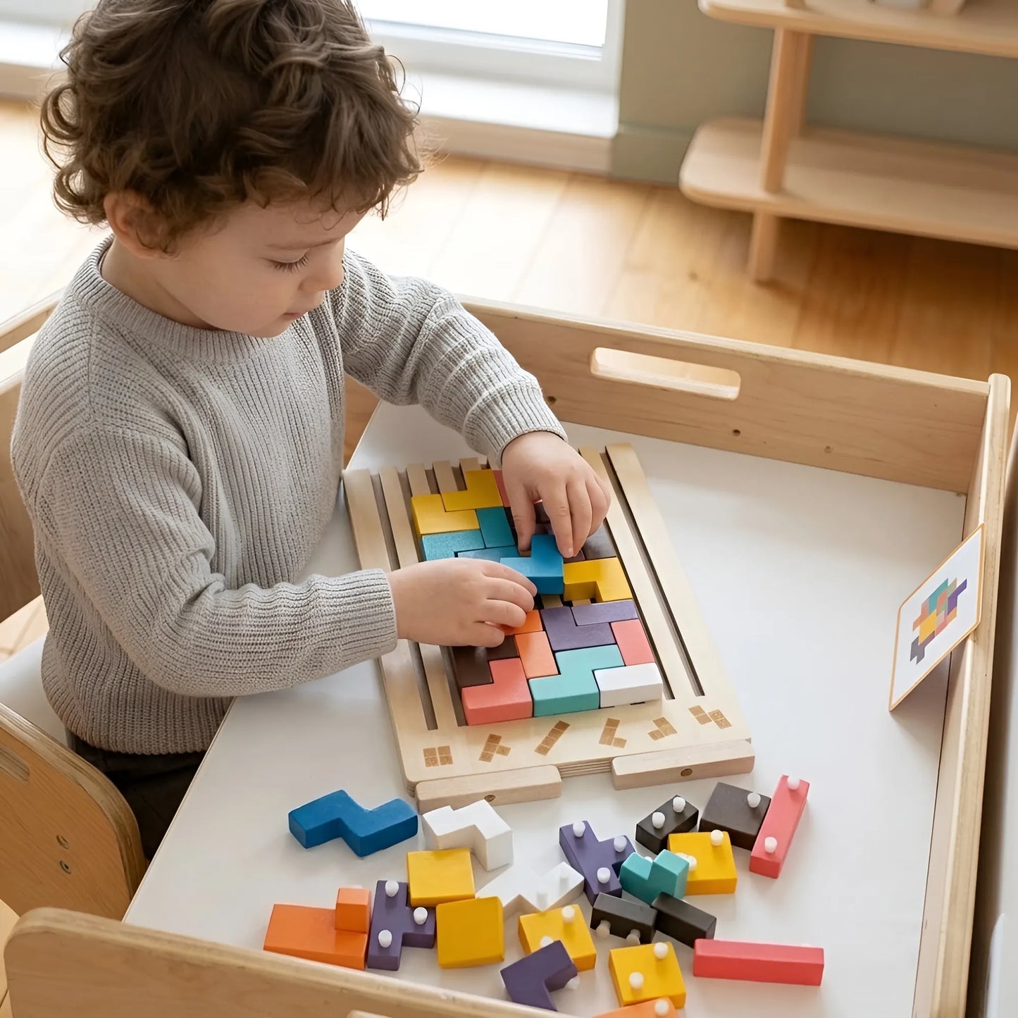 Child playing with a wooden puzzle toy on a table.