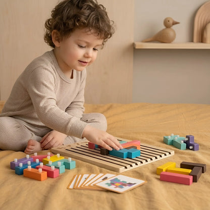 Child playing with colorful wooden blocks on a wooden table