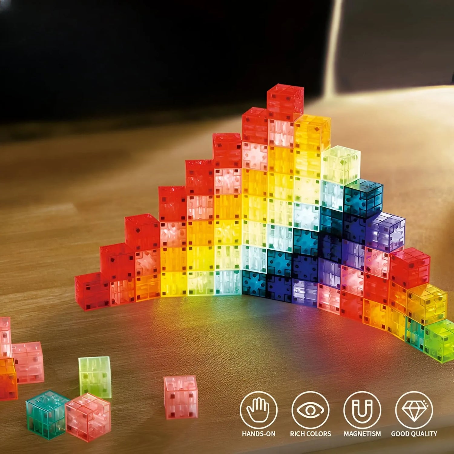 Colorful magnetic building blocks on a wooden surface with icons indicating hands-on, rich colors, magnetism, and good quality.